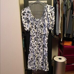 Black and White Floral Dress. Short sleeves. Goes to the knees.